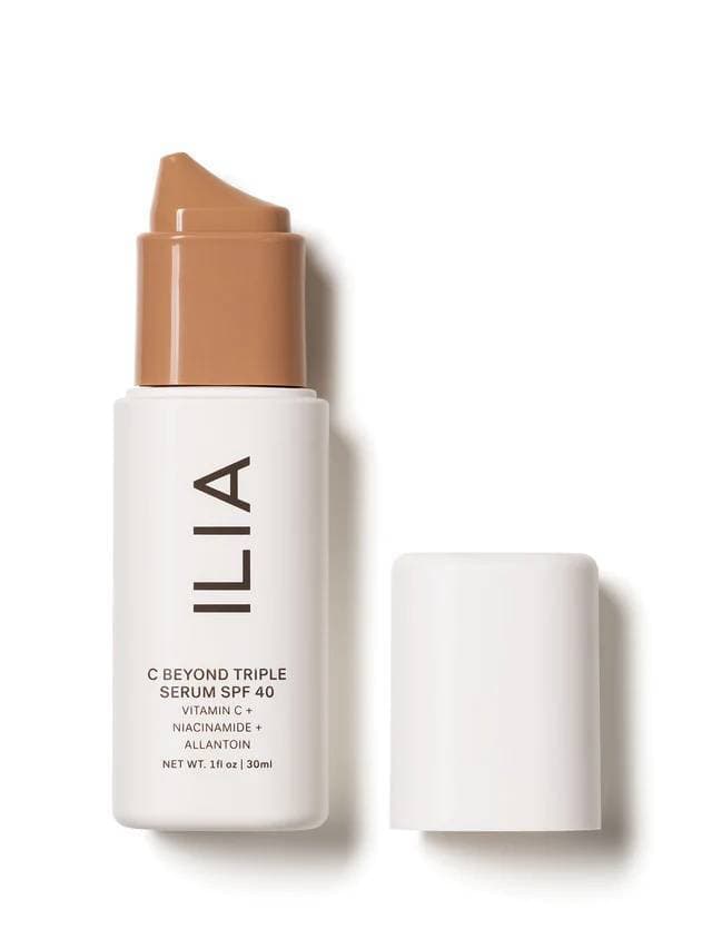 a white cosmetics container with a tan pump labeled with the brand name Ilia