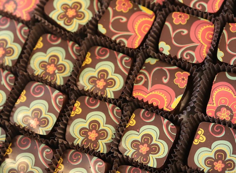 Stamped chocolates, painted green and red, made by Ragged Coast Chocolates. Photo by Doug Mindell.