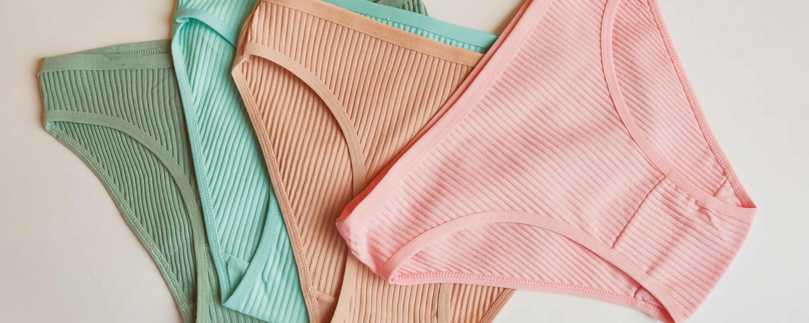 Four pairs of women's underwear in varying colors.