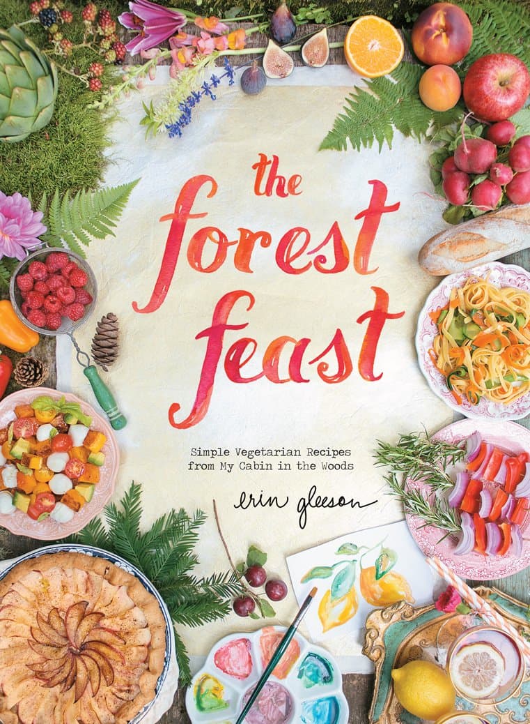 The colorful cover of the cookbook, The Forest Feast: Simple Vegetarian Recipes from My Cabin in the Woods by Erin Gleeson.