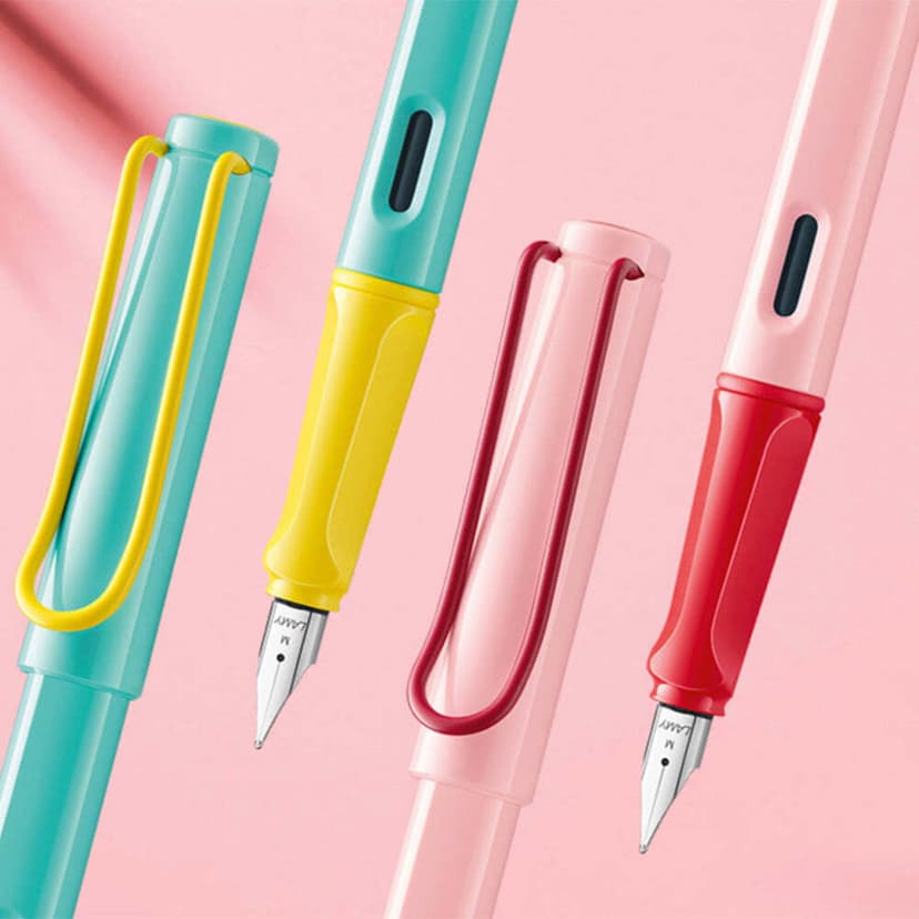 colorful green yellow pink and red fountain pens